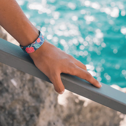 a bracelet with rose and leaves details