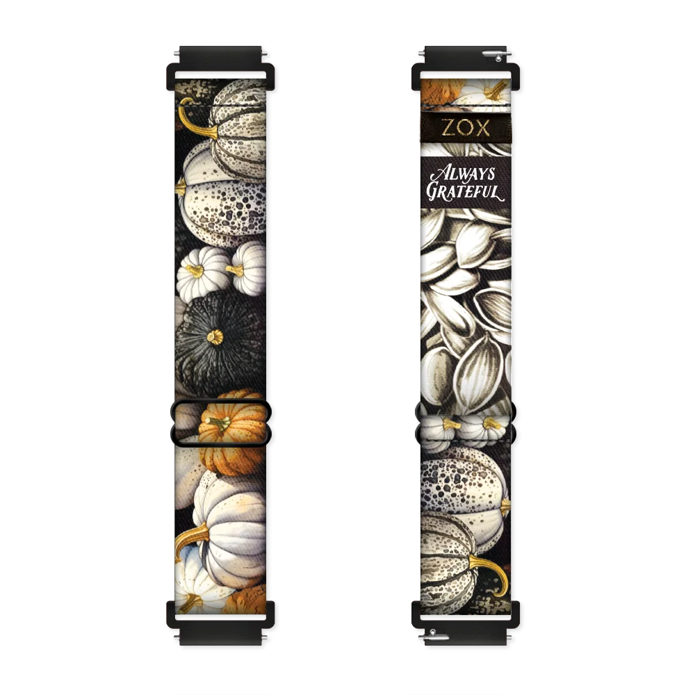 Android Watch Band render of the Always Grateful Watch Band design, showing both the outside (left) and inside (right) of the band. The outer side on the left features detailed pumpkins in neutral tones white, cream, orange, and black, creating a rustic, seasonal feel. The inside on the right is a mix of detailed pumpkins and flowers in neutral tones white, cream, orange, and black. Displayed on the band is the phrase "Always Grateful" in elegant white script. The ZOX logo is on a black tag sewn near top.