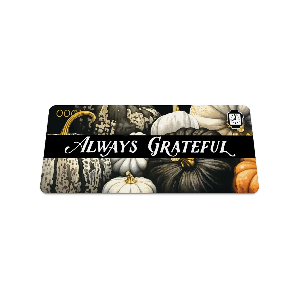 Product photo of the front of the collector’s card for Always Grateful. The design features detailed pumpkins in neutral tones of white, cream, orange, and black, creating a rustic, seasonal feel.  The text 'ALWAYS GRATEFUL' is prominently displayed in bold white letters across the center.