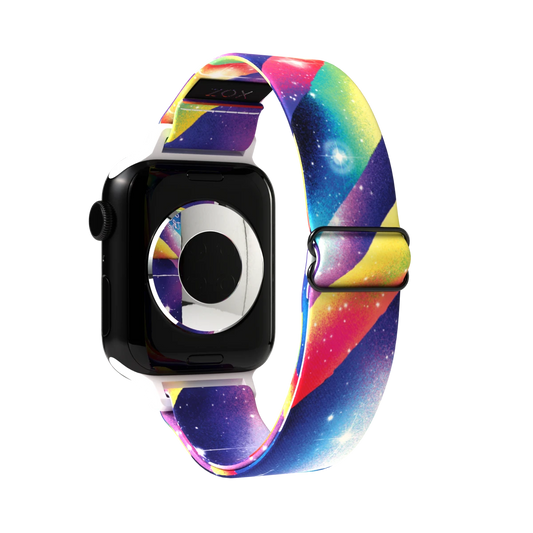 Product photo of the outside of the Among the Stars Watch Band. The design features a colorful, galaxy-theme and showcases a vibrant cosmic design with swirling streaks of pink, yellow, blue, and purple, blending with starry details that evoke a nebula-like appearance. The inside of the band, visible near the top, has a black surface with the brand name "ZOX" subtly printed. 