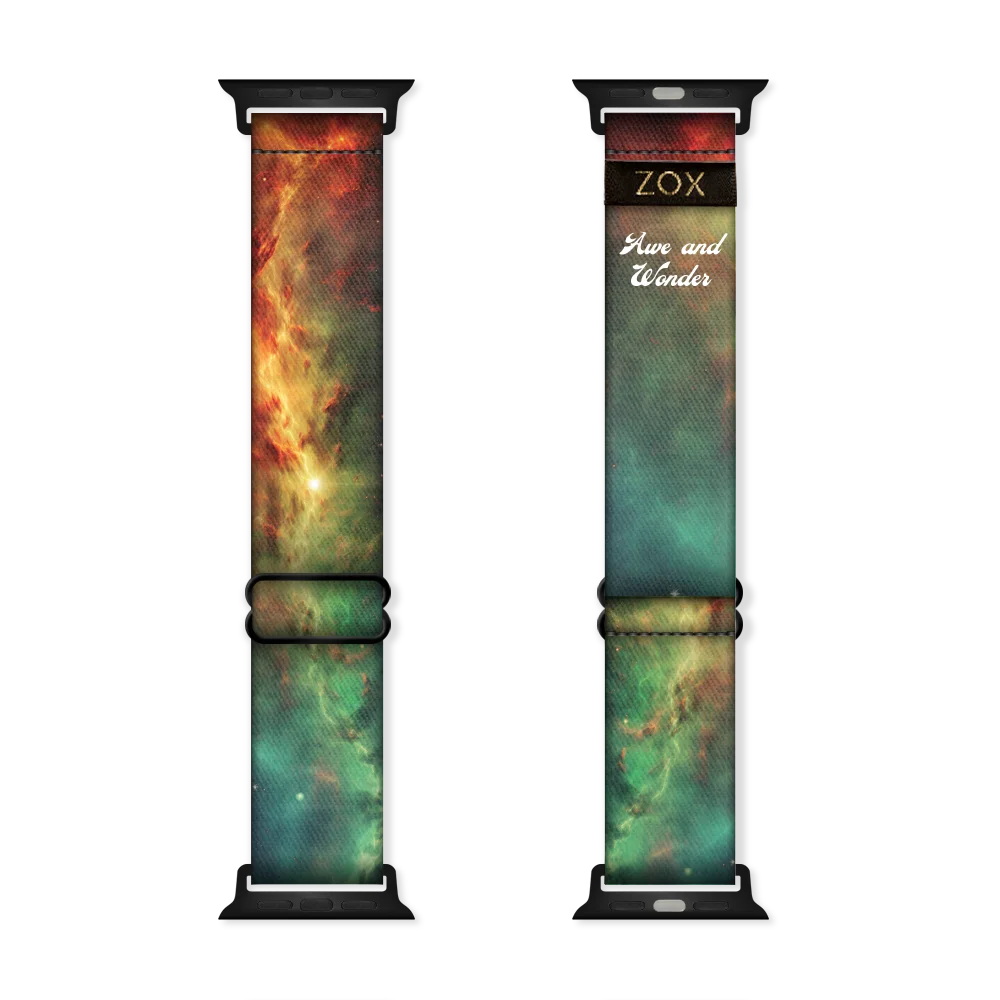 This is a watchband with green, orange and yellow design that looks like a space nebula. The design is the same on the inside and says Awe & Wonder. 