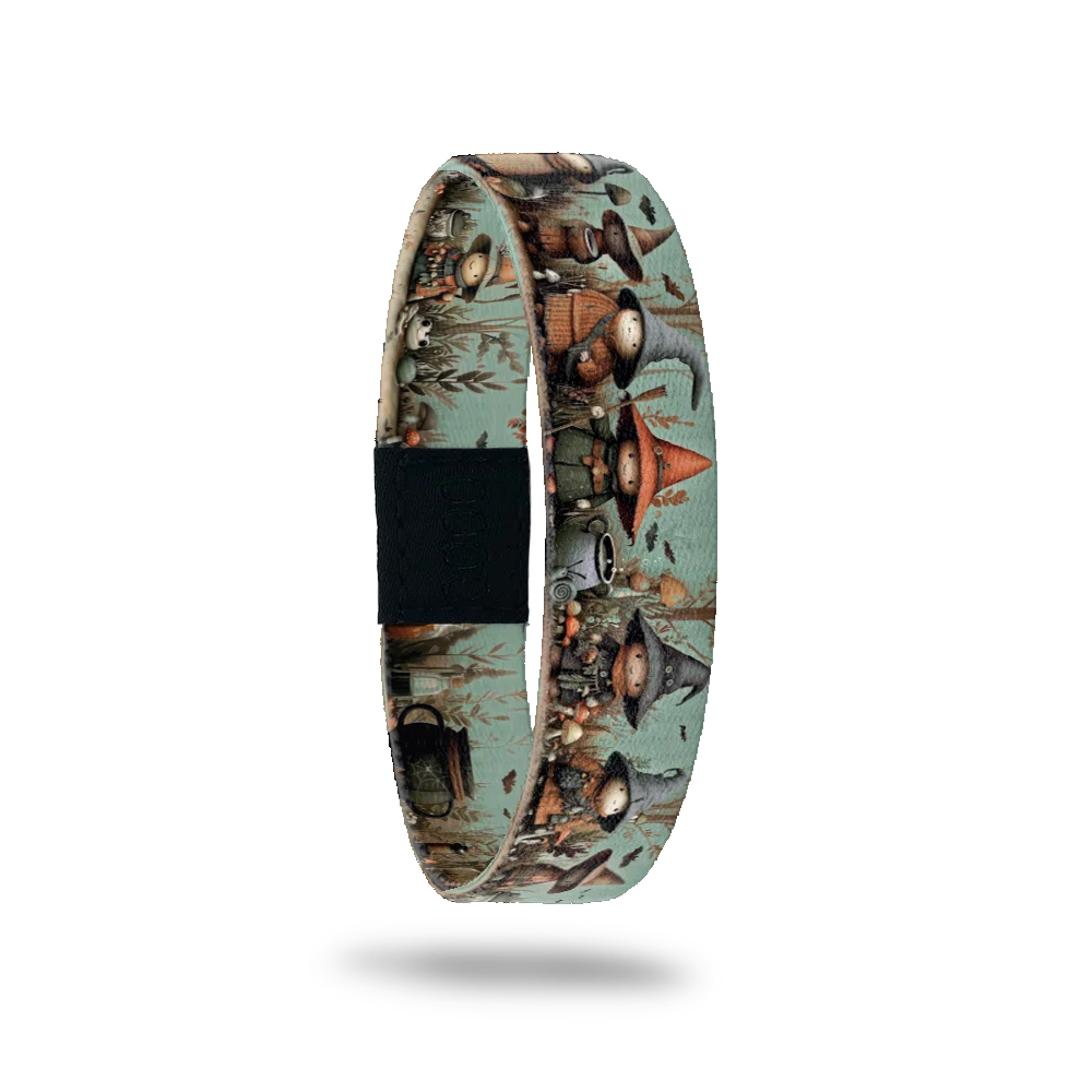 Brew Can Do It bracelet showing small witches in pointed hats gathered around a cauldron in a green wood