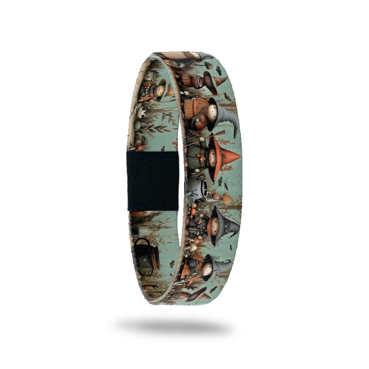 Brew Can Do It bracelet showing small witches in pointed hats gathered around a cauldron in a green wood