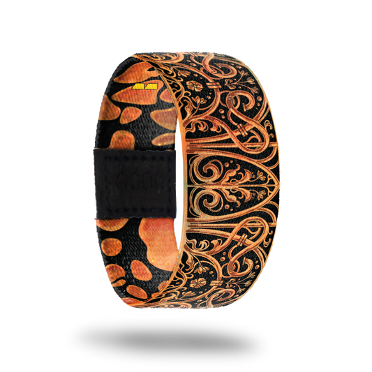 This is a reward item and not purchasble. The design is burnt orange and black with an ornate iron looking deign. The inside is the same and reads Cross The Threshold. 