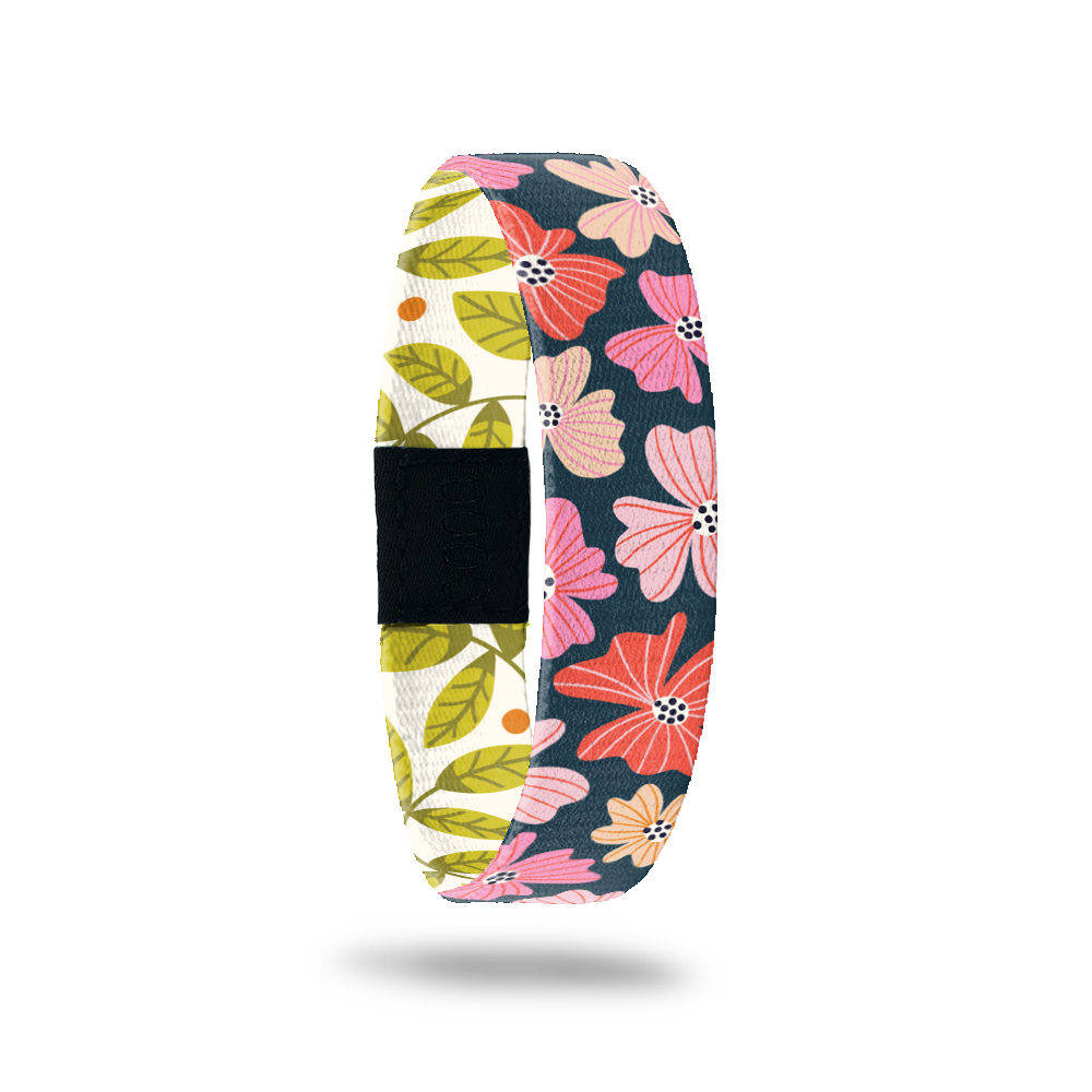 ZOX single with navy blue base and bright pink/red flowers on the outside. Inside is a white base with green leaves and says Enjoy Today. 