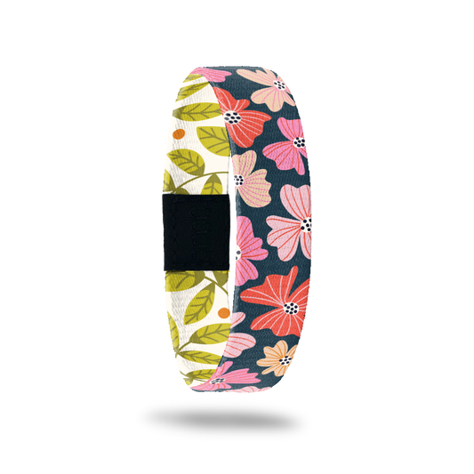 ZOX single with navy blue base and bright pink/red flowers on the outside. Inside is a white base with green leaves and says Enjoy Today. 