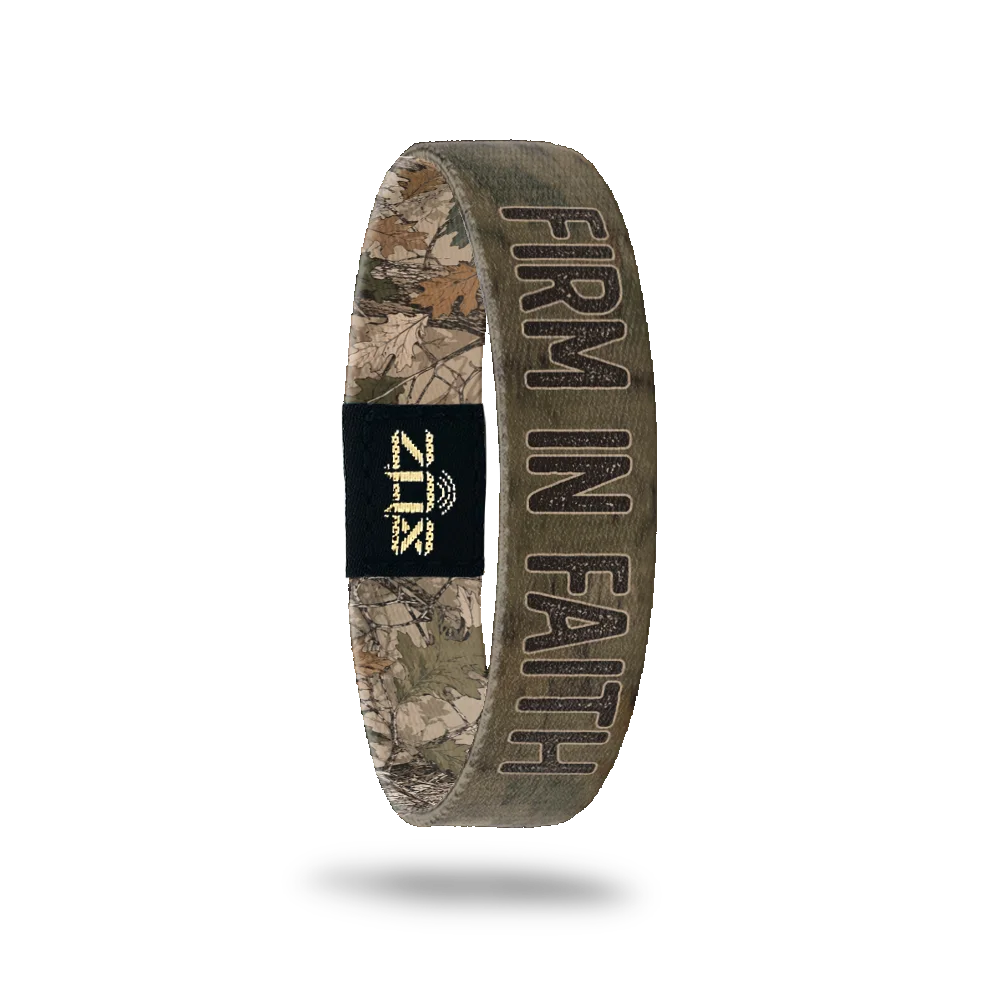 Inside of the Firm In Faith bracelet, with the words Firm In Faith across the woodland camo print