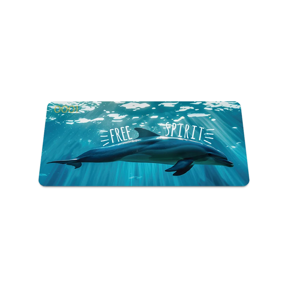 Product photo of the front of the Free Spirit collector's card, featuring a serene underwater scene with a dolphin swimming through blue waters. Bold white text reads "FREE SPIRIT" with lines radiating outward from the text. The serial number "0001" is in the top left corner.