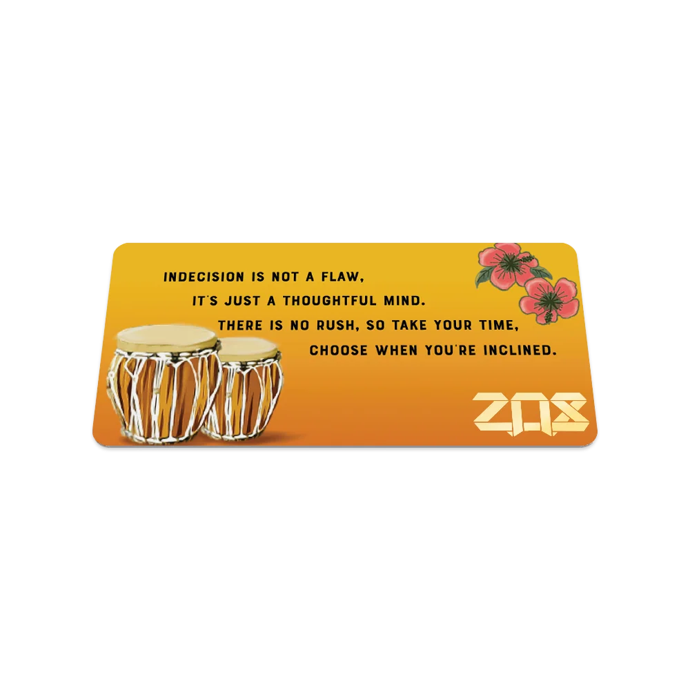 A rectangular bracelet display card with a warm orange gradient background. The card features two detailed bongo drums on the left and two pink flowers in the top-right corner. The text reads: "Indecision is not a flaw, It's just a thoughtful mind. There is no rush, so take your time, Choose when you're inclined." The ZOX logo is prominently displayed in bold gold lettering in the bottom-right corner.