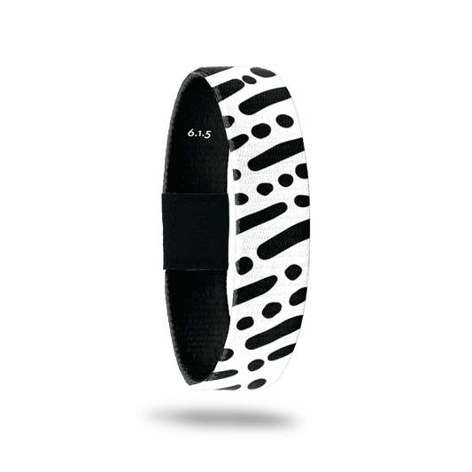 Wristband single is black and white lines and dots in a diagonal pattern. The inside is the same and reads I Am With You Always with the Bible verse 6.1.5.