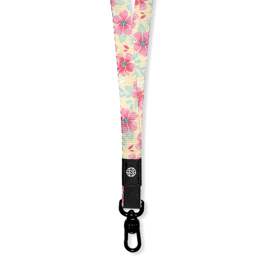 Lanyard with pale yellow base and pink flowers all over. The Inside says I Choose Joy and the lanyard has a metal clip for keys/cards. Each lanyard comes with 2 clips if you need to make a breakaway lanyard. 