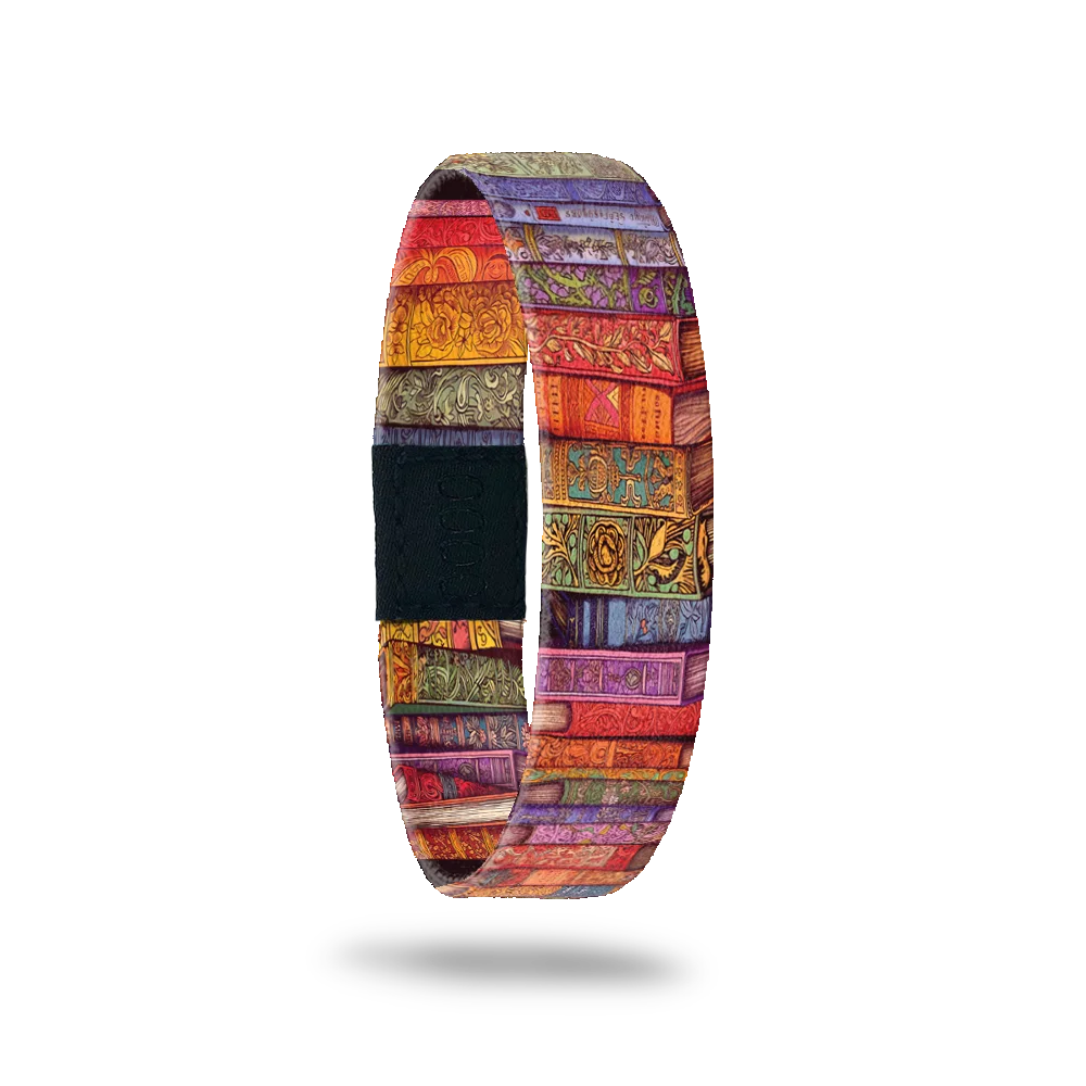 A multicolored elastic wristband featuring a vibrant pattern resembling stacked book bindings.