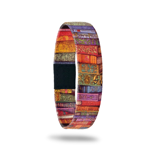 A multicolored elastic wristband featuring a vibrant pattern resembling stacked book bindings.