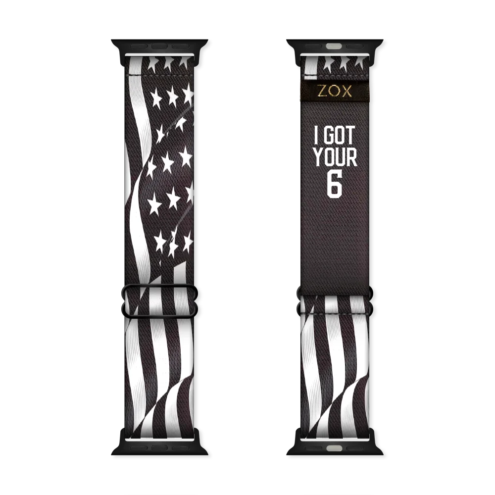 Watchband with a black base and an American flag in all white- stripes and stars. The inside is the same and says I Got Your Six. Check size guide for compatible watches. 