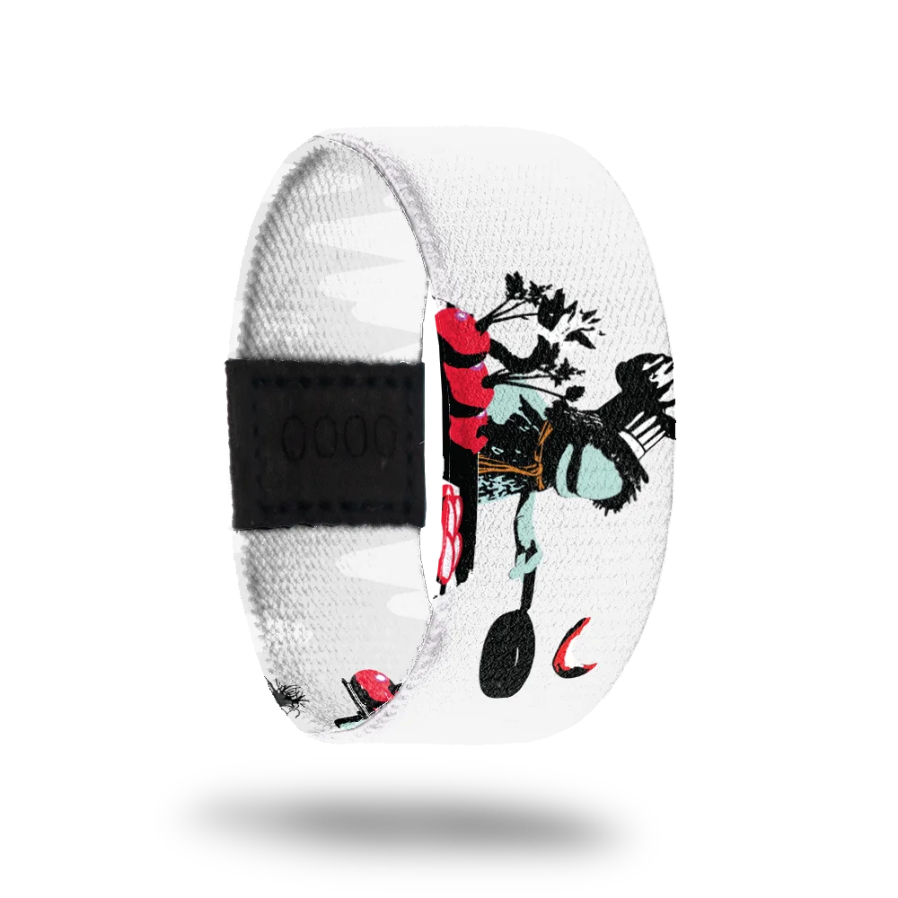 A white bracelet for featuring Boober from Fraggle Rock. Boober is illustrated with his signature hat and scarf, sitting with a frying pan and a bunch of red beets in front of him. The design includes bold black, white, and red accents, adding depth and contrast.