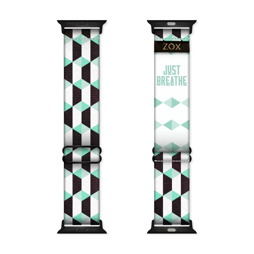 Black, white and mint colored parallelograms all over the design. Inside is the same and says Just Breathe. Check size guide for compatible watches. 