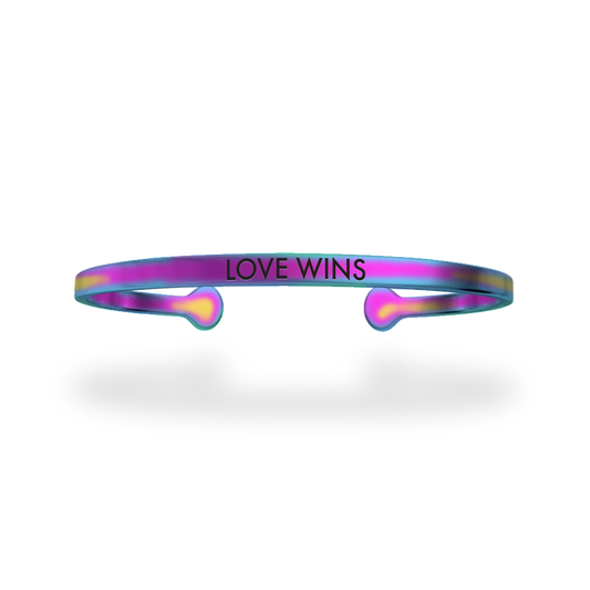 Stainless steel with a holygraphic rainbow coating and has Love Wins etched in it. 