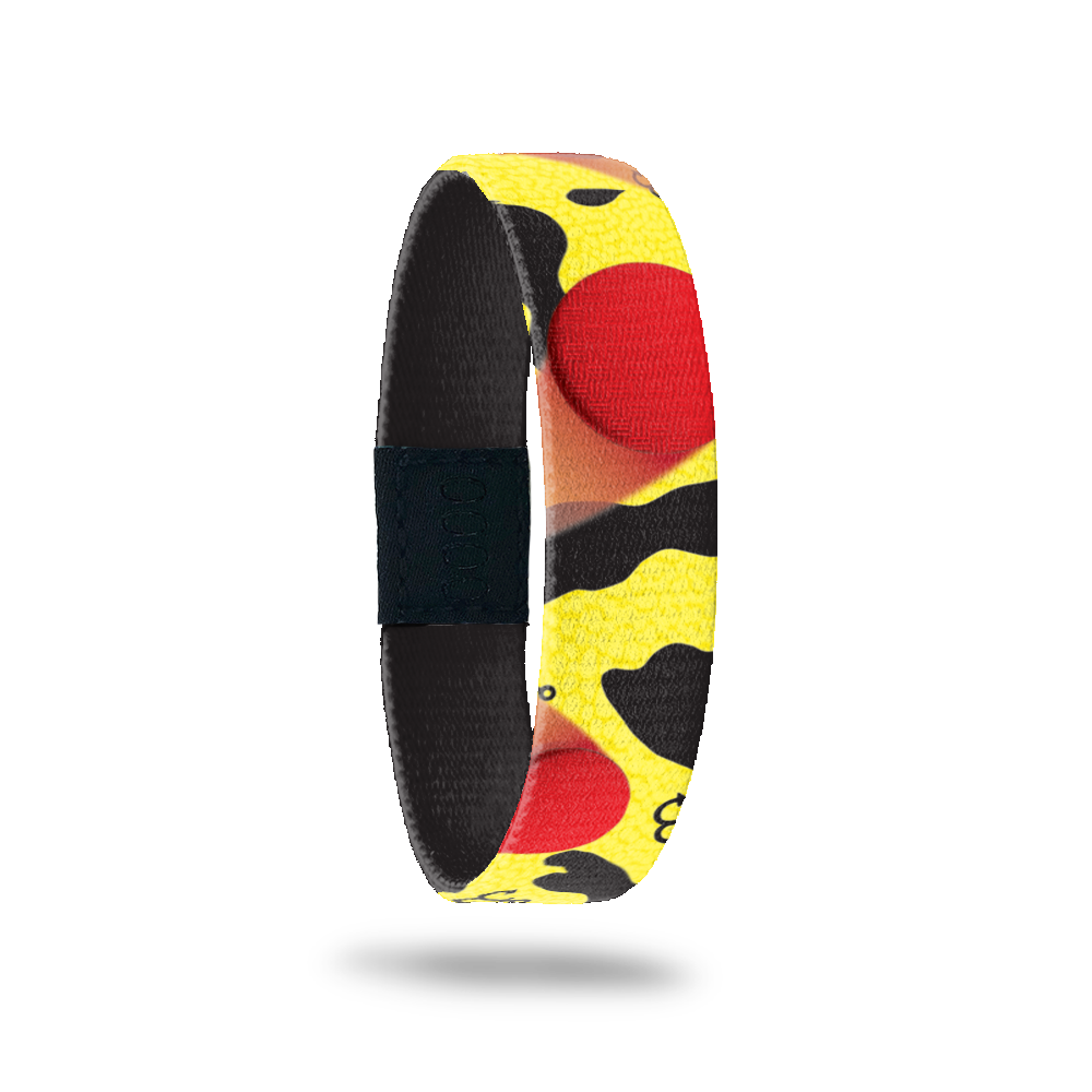 Yellow and black abstract with big red dots all over. Comes with a matching pin of a monster with black and yellow cow print, jumping over something. 