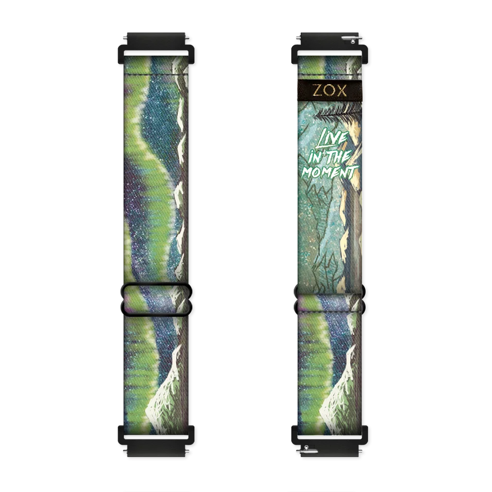 Watchband with a green and blue design of the Northern Lights. Inside is the same and reads Live In The Moment. Check the size guide for applicable watches.