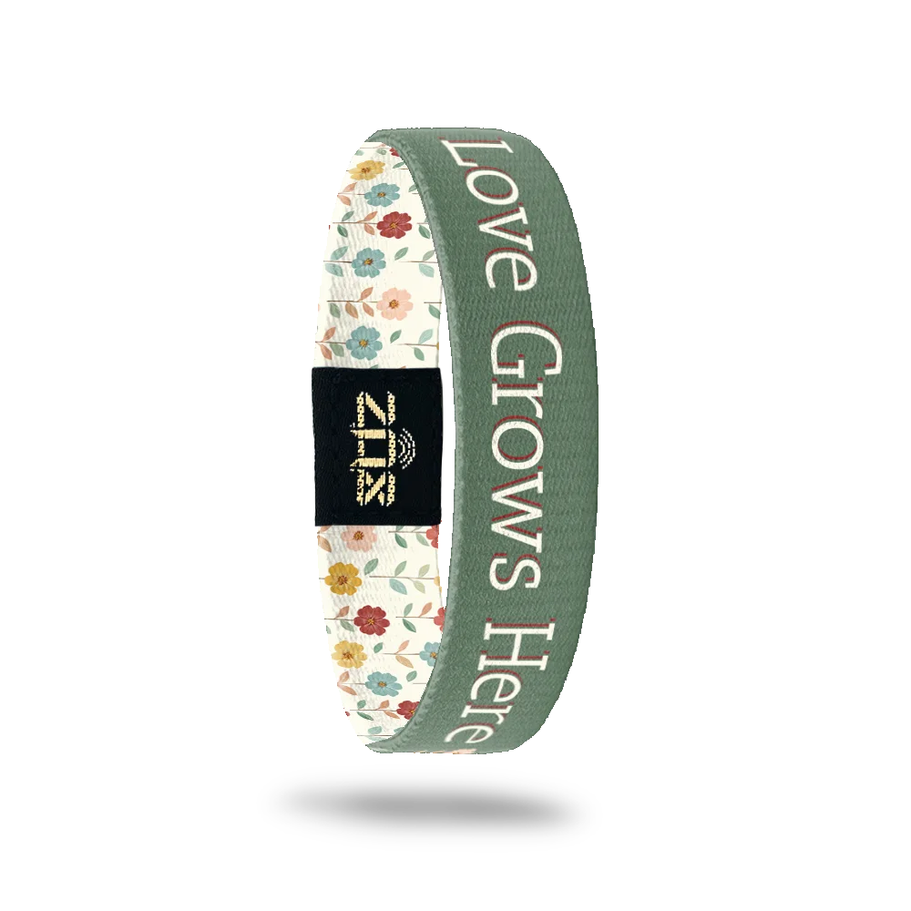 Inside of the Love Grows Here bracelet, with the words Love Grows Here across the floral print