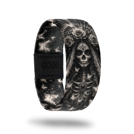 Love Never Dies bracelet showing intricate silver sugar skull and butterfly artwork on deep black