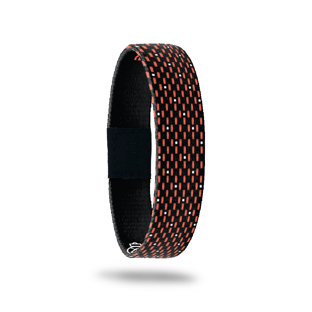 Outside Design of Make the Nevers Possible: black background with orange and white line and dot pattern