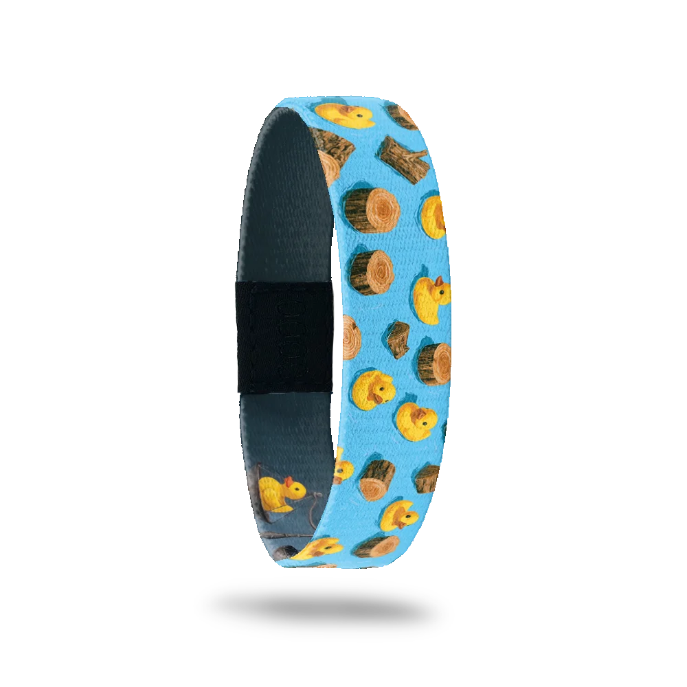 Made of Wood bracelet showing yellow rubber ducks and floating logs on bright blue water