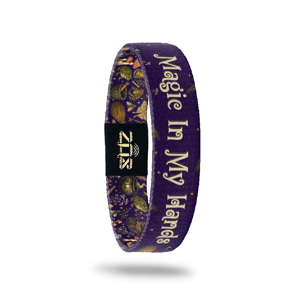 Inside of the Magic In My Hands bracelet, with the words Magic In My Hands across the purple print