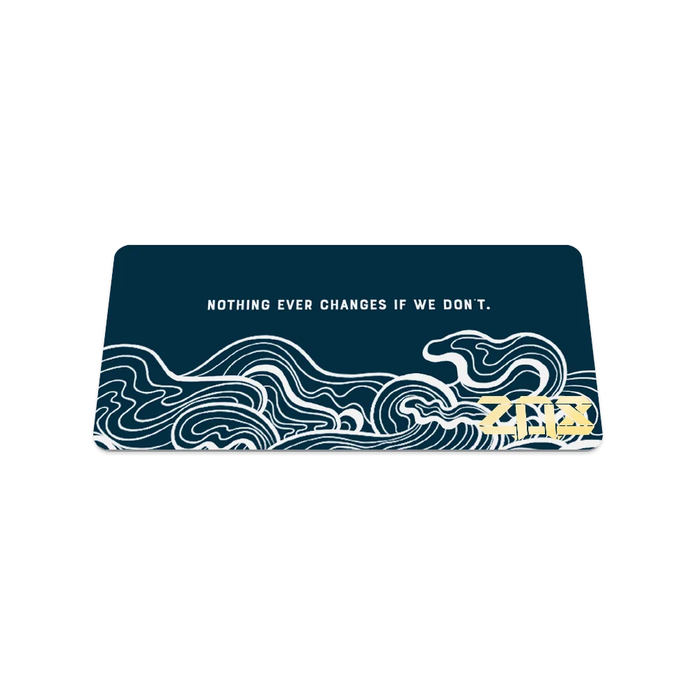 Back of the card is dark teal with white waves and says "Nothing ever changes if we don't"