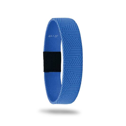 Wristband single in medium blue color whit a lighter blue abstract line design on top. The inside is all blue and reads Nothing Is Impossible. It also lists Bible vers 42.1.37.