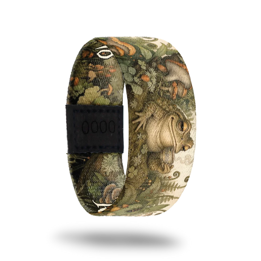 Respectfully, No bracelet showing a toad holding a teacup in a mossy woodland of ferns and mushrooms