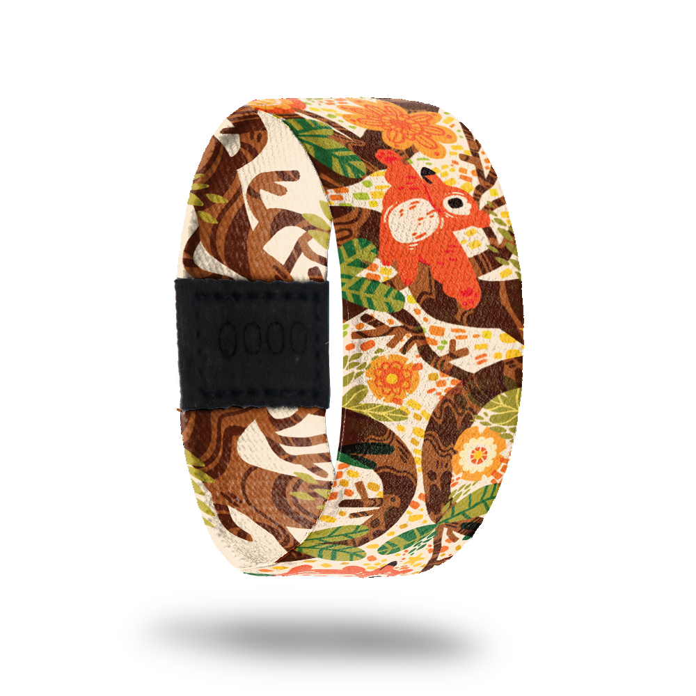 Wristband strap is a cartoon scene of a bear climbing a tree. The inside is the same and reads See What's In Store. Comes with a matching lapel pin and collector's box. 