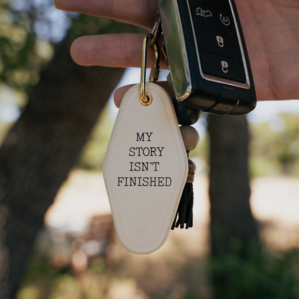 My Story Isn't Finished Leather Keychain