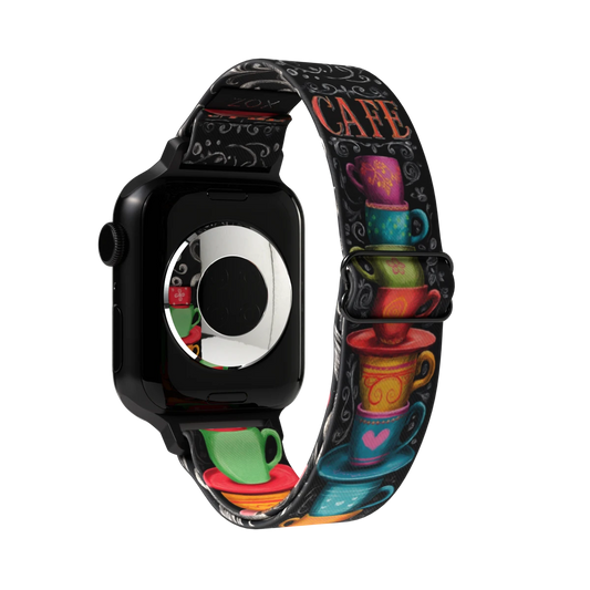 Outside is black with colorful and decorative coffee cups stacked on top of each other. Says Cafe at the tope and has chalk swirls all over. 