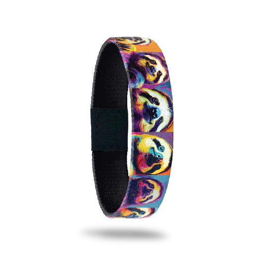 A vibrant bracelet featuring colorful, psychedelic portraits of sloths with varied facial expressions against a background of warm orange, purple, and blue tones. A black rectangular patch with etched serial numbers is visible on one side of the strap.