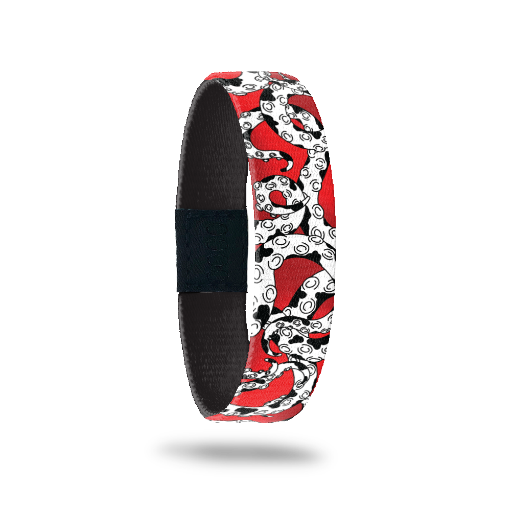 Red design with white and black octopus tentacles all over. Comes with a matching pin of an octopus monster in a vampire coat that looks like a dalmation with spots. 