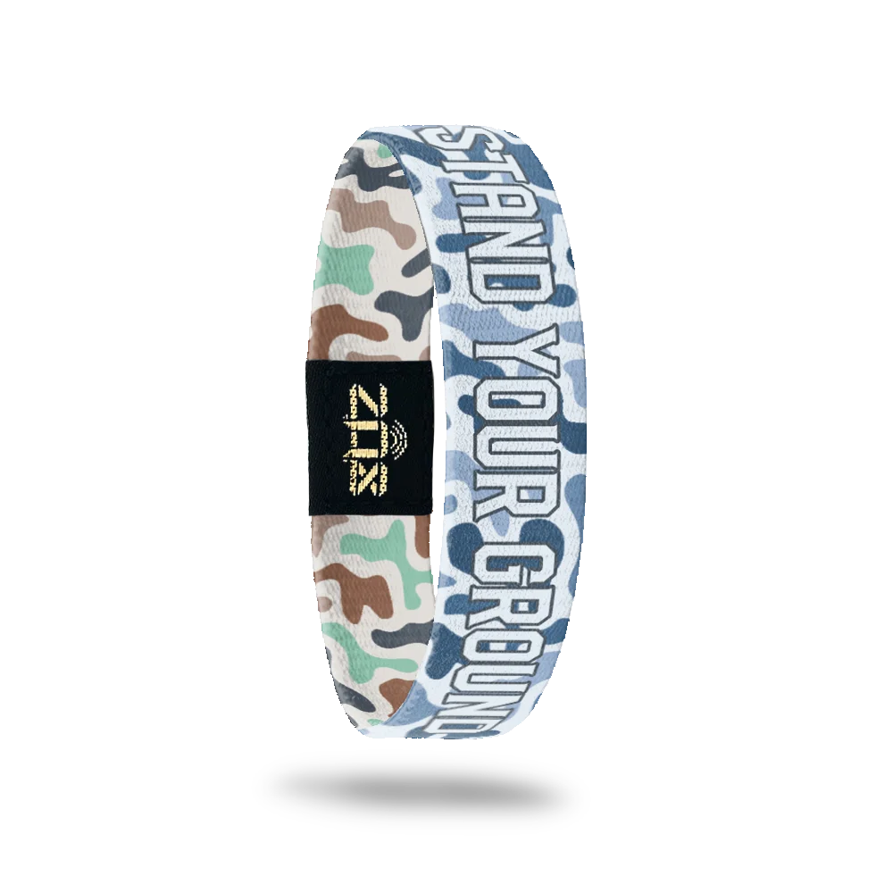 Inside of the Stand Your Ground bracelet, with the words Stand Your Ground across the pastel camo print