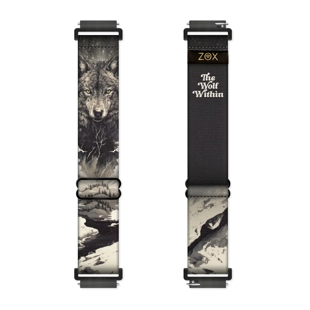 The Wolf Within Watch Band displays a detailed wolf’s face and winter landscape on one side, symbolizing resilience, with "The Wolf Within" text on the other—all in bold black and white tones.