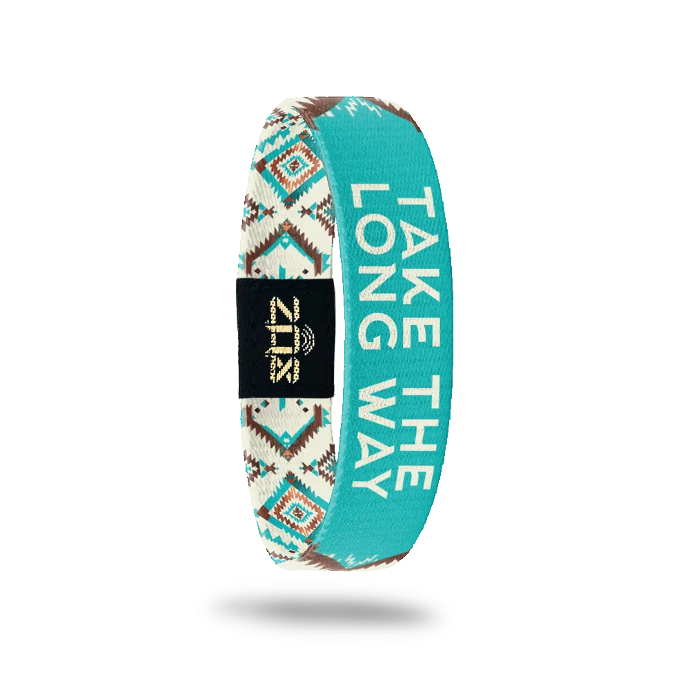 Inside of the Take The Long Way bracelet, with the words Take The Long Way across the southwestern print