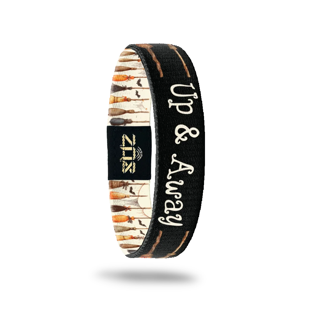 Inside of the Up & Away bracelet, with the words Up & Away across the broom print