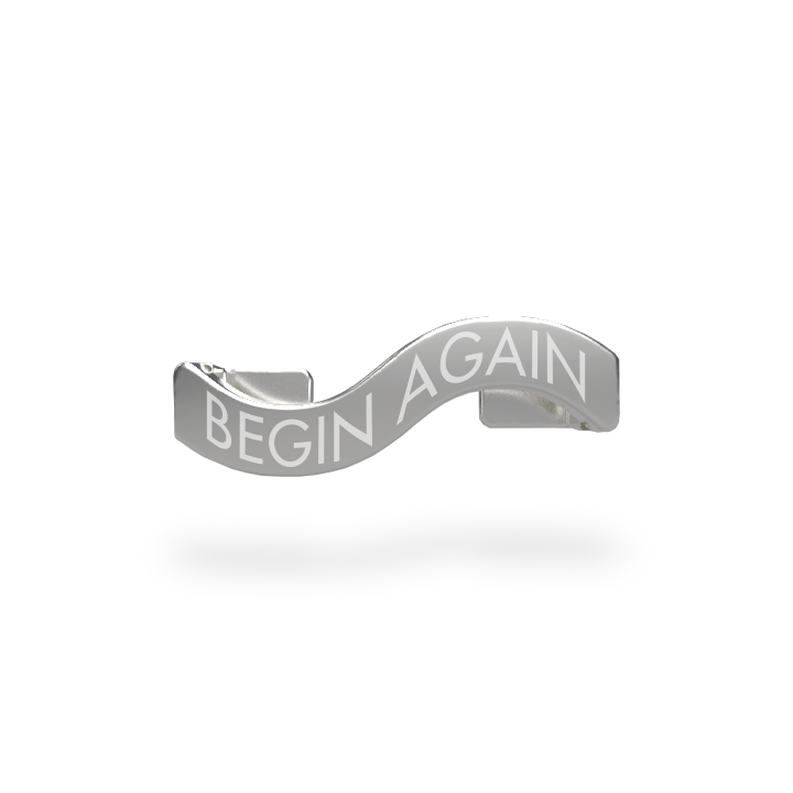 This is a charm that fits ZOX single wristbands, lanyards and hoodie strings only.  It is made from stainless steel and is silver in color. The words BEGIN AGAIN are etched in the metal. 