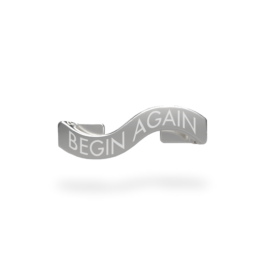 This is a charm that fits ZOX single wristbands, lanyards and hoodie strings only.  It is made from stainless steel and is silver in color. The words BEGIN AGAIN are etched in the metal. 