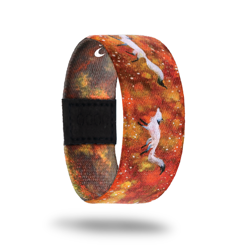 This is a reward item and not purchasable. The design is orange and red nebula with white foxes running along the strap. The inside is the same and reads Courageous. This is the moonstone for the Series 1 collection. 