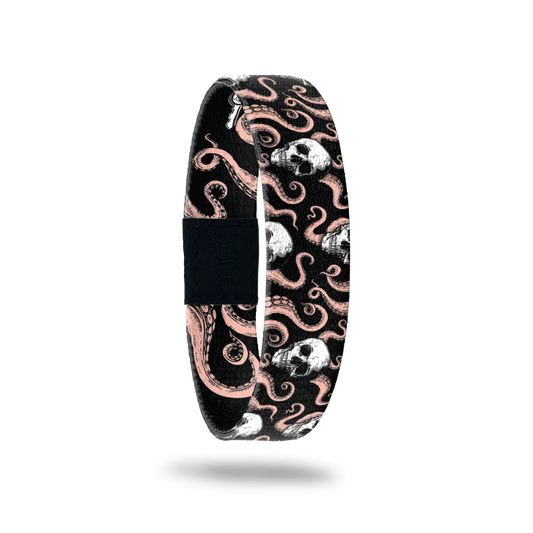 Black wristband with pink octopus tentacles all over and white skulls. Inside is the same without skulls and says Fight For What You Believe In. 