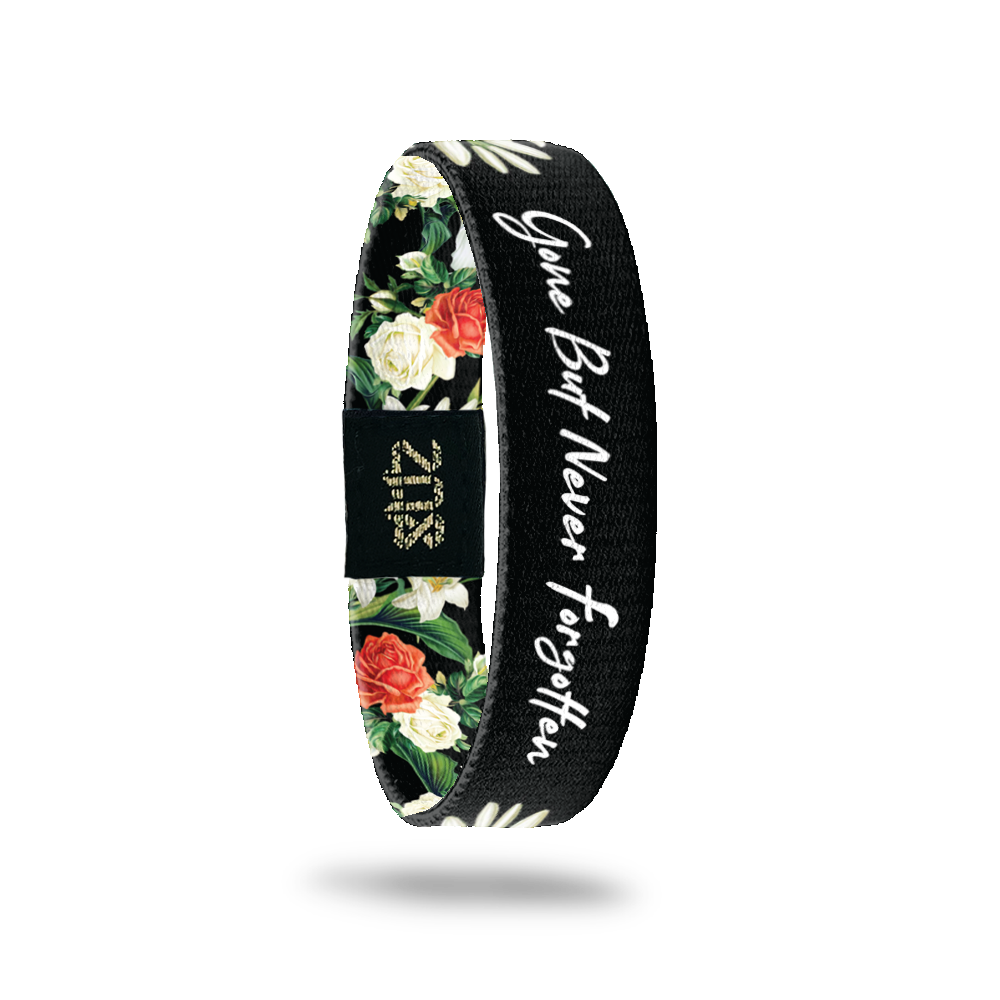 Inside Design of Gone But Never Forgotten: black background with red and white floral and greenery design with opening that has the white text ‘Gone But Never Forgotten’