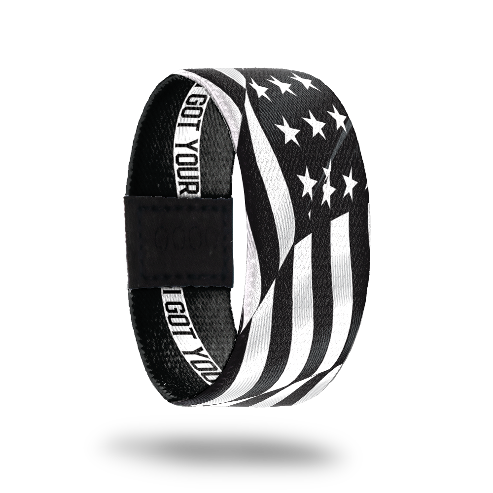 Outside Design of I Got Your Six. wavy black and white United States flag 