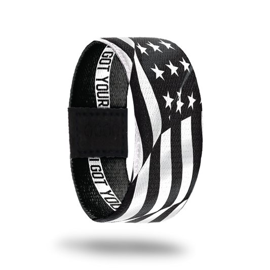 Outside Design of I Got Your Six. wavy black and white United States flag 