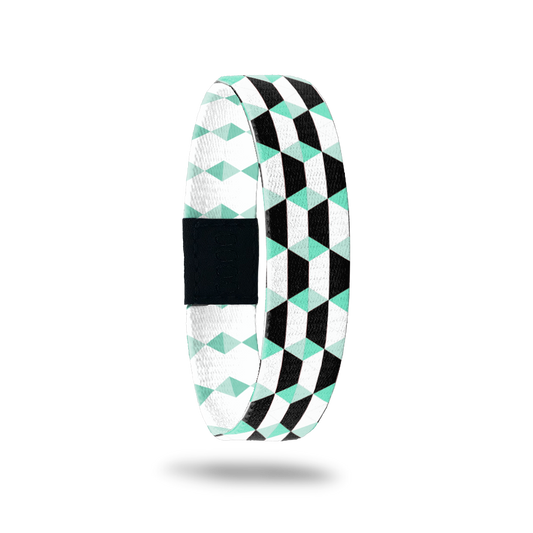 Black, white and mint colored parallelograms all over the design. Inside is the same but in mint and white and says Just Breathe. 