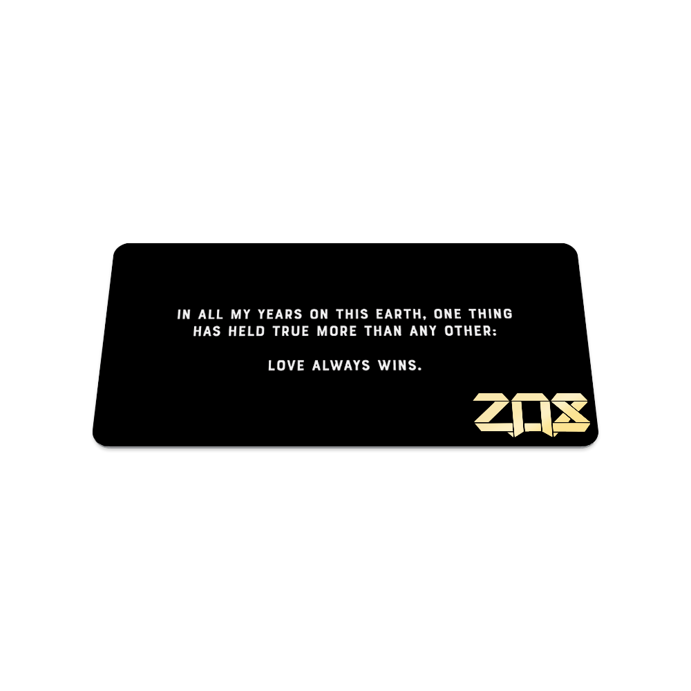 Back collector's card image of Love Wins: black card with white text 'In all my years on this earth, one thing has held true more than any other: love always wins"