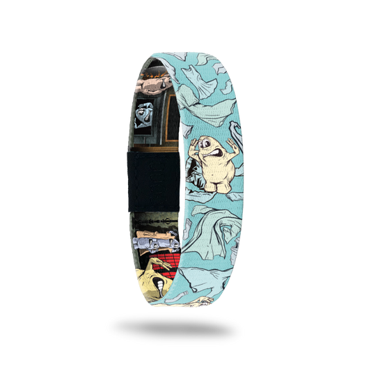 Bracelet is various blue and the design is a chunky monster that is "naked" and surrounded by clothes. The inside is the monster in various funny scenes trying to find his clothes. Comes with a pin of the same monster. 
